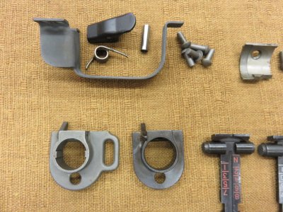 Various parts - rear sights, handguard retainers, trigger guards...